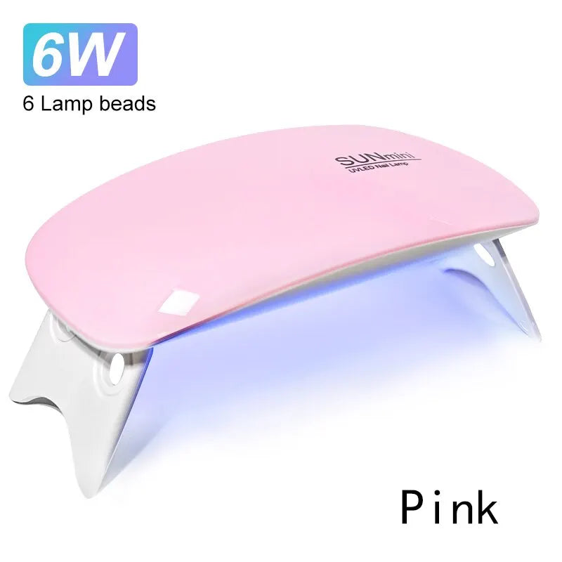 Ansoff 6W Mini Nail Dryer with 6 LED UV bulbs, portable design, USB cable, used for drying nail polish and gel at home.