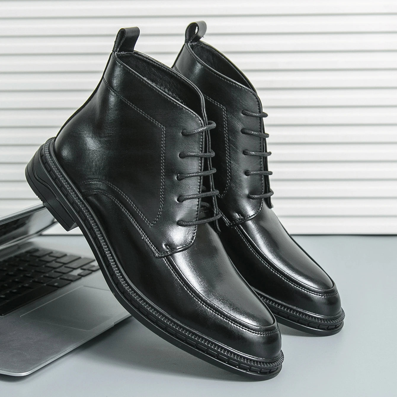 Ansoff men's leather ankle boots with pointed toe, stylish design, and luxury finish, ideal for business and formal wear.