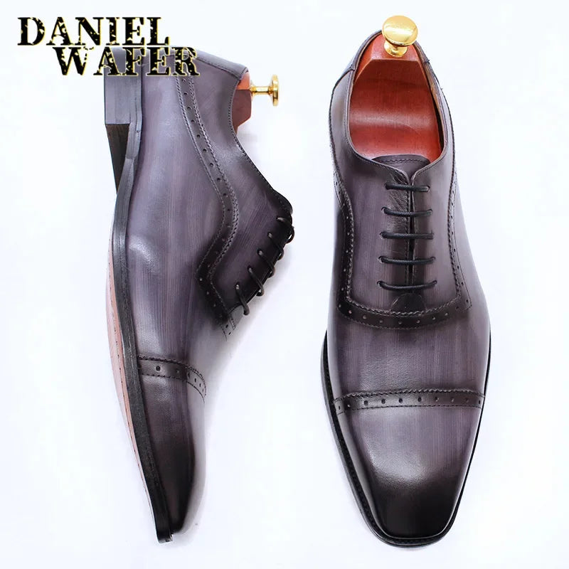 Elegant men's Oxford shoes by Ansoff in black genuine leather with brogue detailing, classic cap toe, lace-up formal dress shoes.