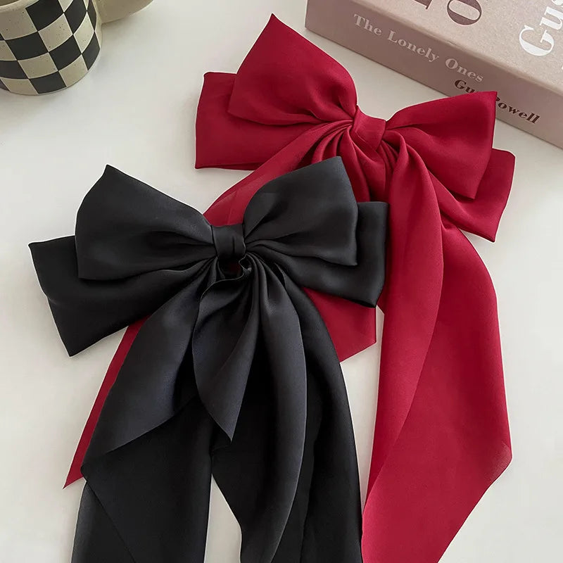 Ansoff Korean hair accessories featuring large satin bowknot clips with long ribbons, suitable for women and girls.