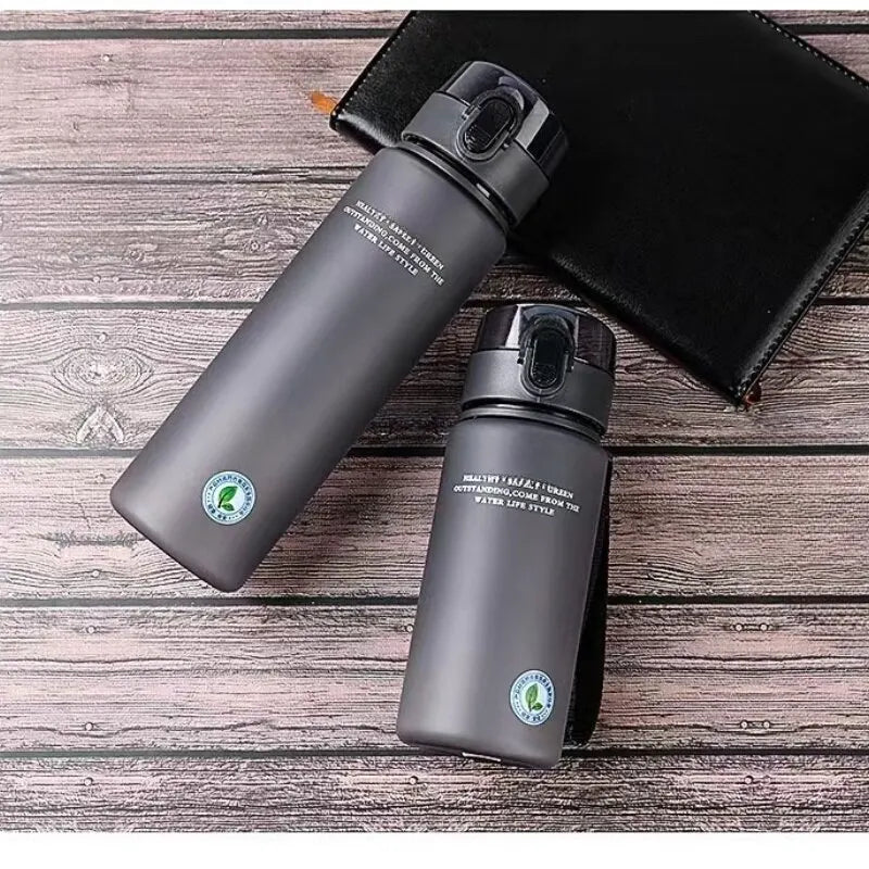 Ansoff BPA-free leak-proof sports water bottle, portable 400ml or 560ml size, ideal for hiking and outdoor activities.