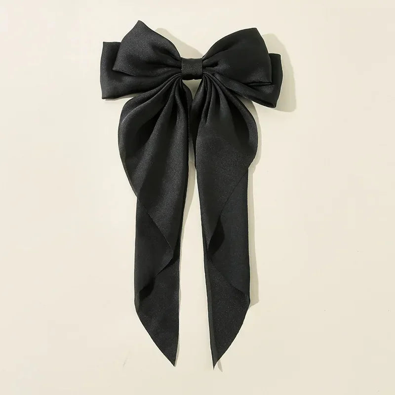 Ansoff Korean hair accessories featuring large satin bowknot clips with long ribbons, perfect for women and girls.