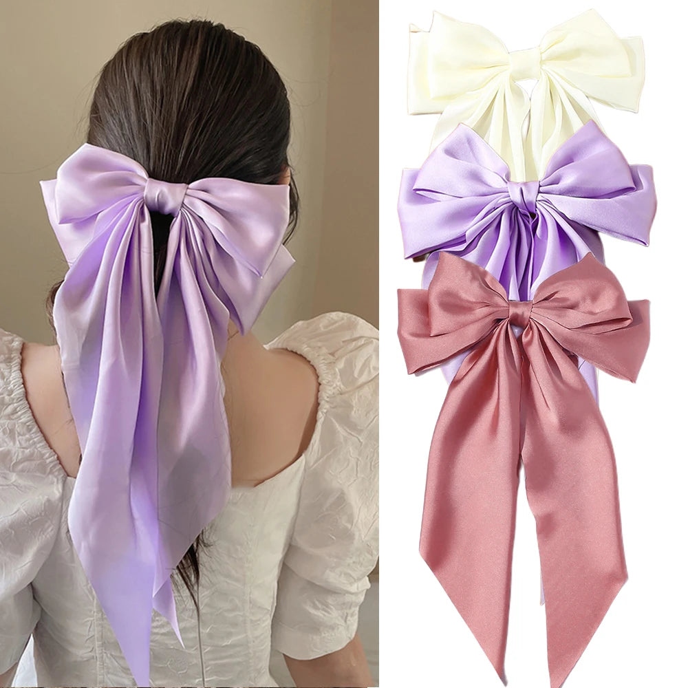 Ansoff Korean hair accessories featuring large satin bowknot hair clips with long ribbons for women and girls.