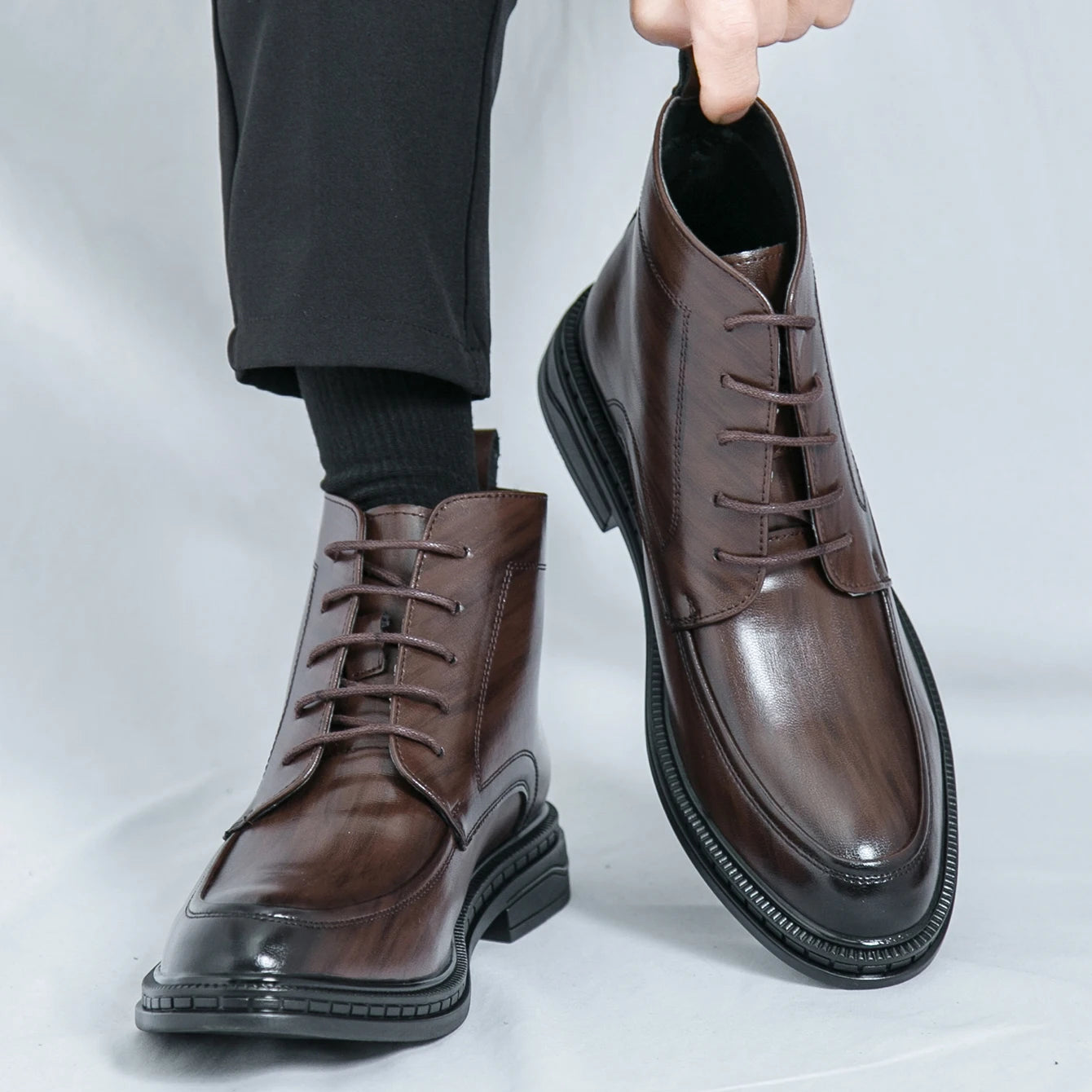 Ansoff men's leather ankle boots with pointed toe, classic oxford style, featuring sleek design and luxury short leather construction.