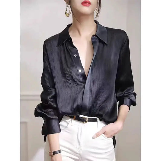 Black satin women's long-sleeved blouse with a loose fit, ideal for office wear and elegant spring fashion by Ansoff.