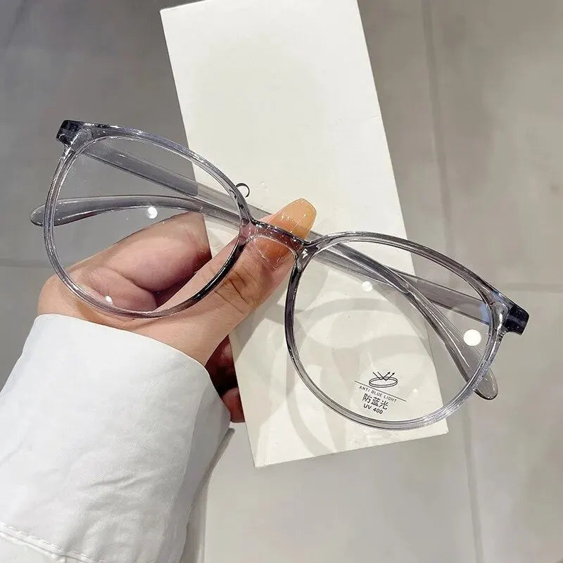 Clear anti-blue light blocking glasses with replaceable lenses from Ansoff, designed for women and men, featuring a modern frame.