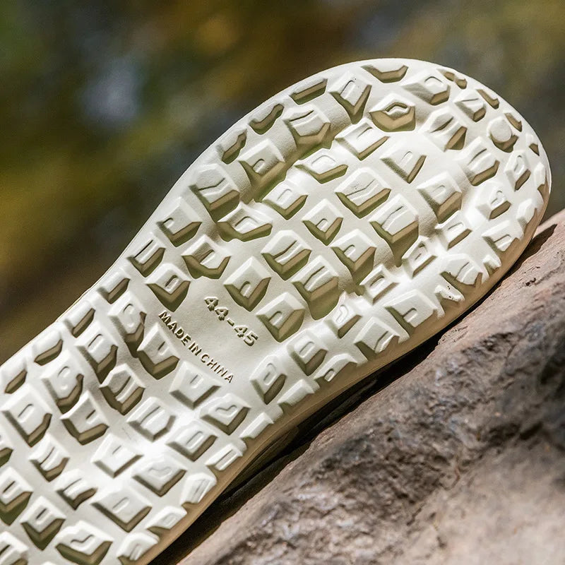Ansoff wading shoes with thick soles, slip-on outdoor slippers featuring anti-slip sports sneaker design.