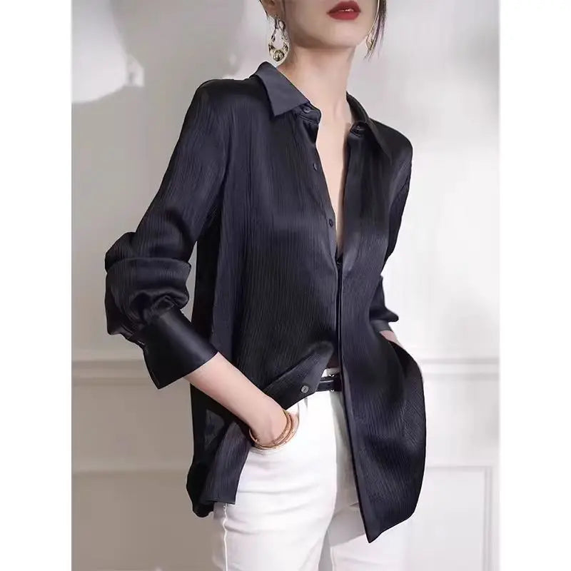 Black satin women's blouse by Ansoff featuring long sleeves, loose fit, and elegant texture, ideal for office or work wear.