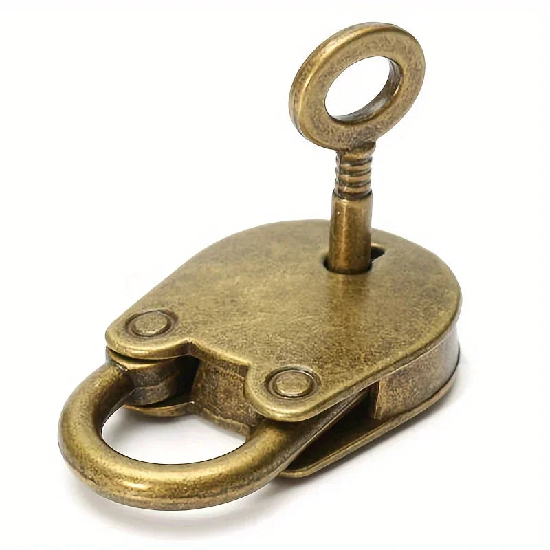 Vintage metal lock and key set by Ansoff, featuring a mini old-fashioned padlock with intricate details and a matching key.