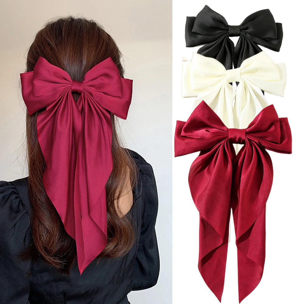 Ansoff Korean hair accessories featuring large satin bowknot clips with long ribbons for women and girls, spring clamp style.