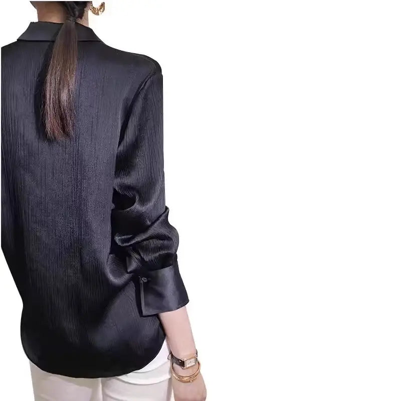 Black satin women's blouse with long sleeves, loose fit, elegant office wear by Ansoff, perfect for spring and work attire.