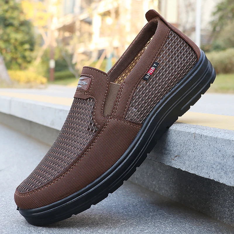 Ansoff men's woven knitted running shoes in black with breathable mesh, lightweight design, and non-slip sole for outdoor sports.