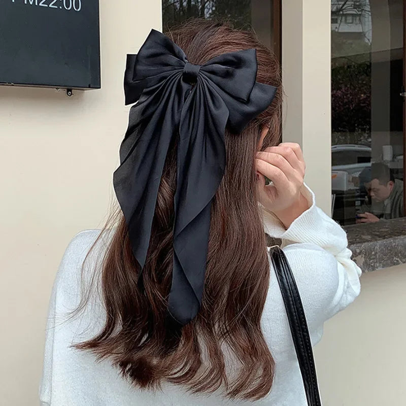 Ansoff Korean hair accessories featuring large satin bowknot clips with long ribbons for women and girls, spring clamp design