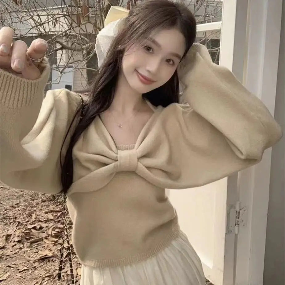 Ansoff women's two-piece sweater suit with suspender vest, long sleeve top, and bow details, perfect for autumn fashion.