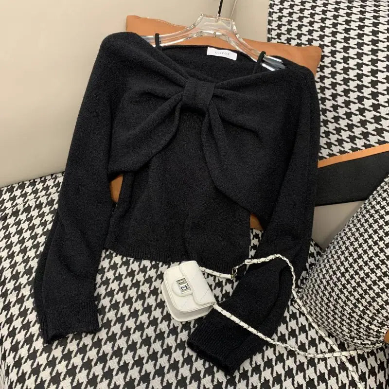Ansoff women's two-piece sweater suit with suspender vest, long sleeve top, and bow detail in autumn fashion, shown in the image.