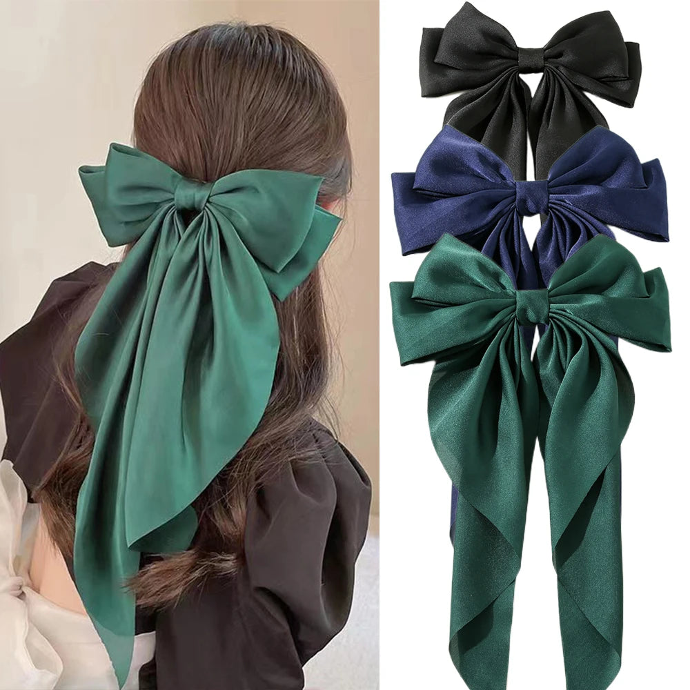 Ansoff Korean hair accessories featuring large satin bowknot clips with long ribbons, suitable for women and girls.