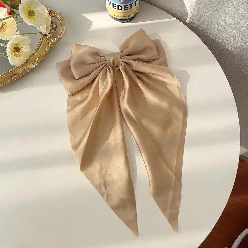 Ansoff Korean hair accessories featuring large satin bowknot clips with long ribbons, perfect for women and girls' spring hairstyles.