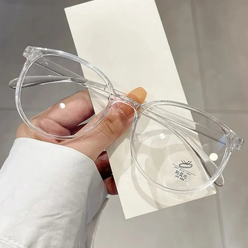 Clear anti blue light glasses by Ansoff with replaceable lenses, designed for women and men to block blue light and reduce eye strain.