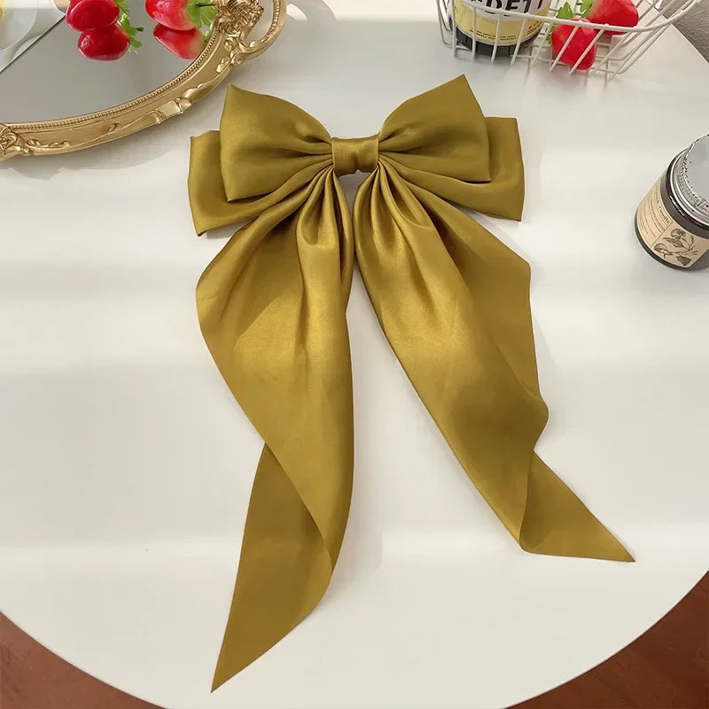 Ansoff Korean satin hair clips with large bowknot and long ribbon, spring clamp style for women and girls, elegant hair accessory.