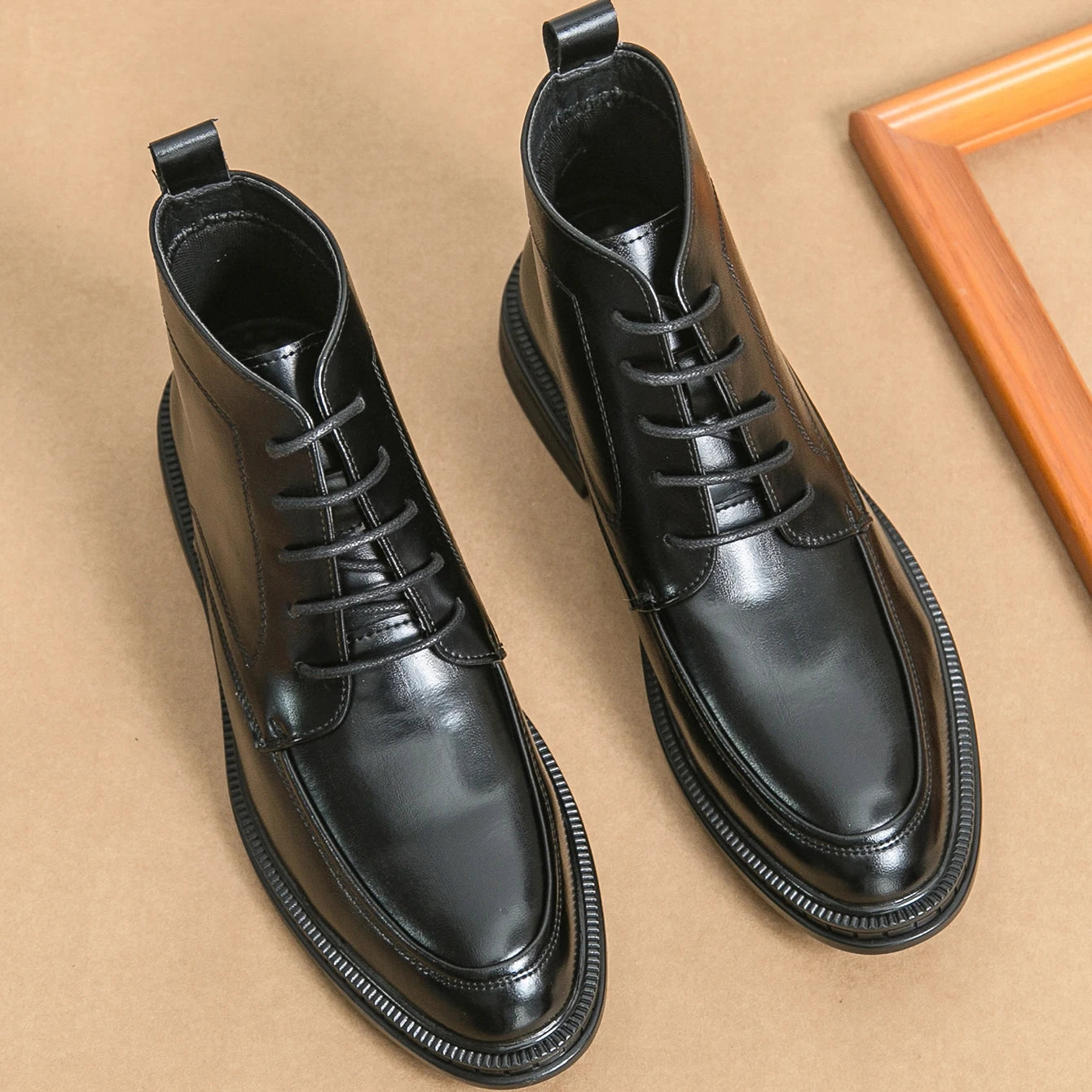 Ansoff men's leather Oxford boots with pointed toes, ankle height, sleek design, ideal for business and formal occasions.