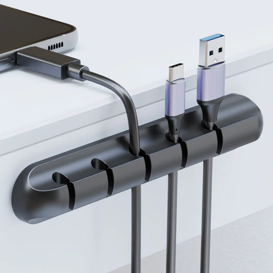 Ansoff adhesive cable holder clips for managing USB, power, and mouse cables on desktop and nightstand surfaces.